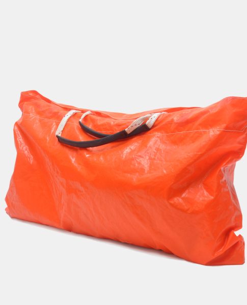 Try our extra large carryall tote bag! It is made from life rafts, it is waterproof, and can carry everything, while being able to fold into a small size when not in use.